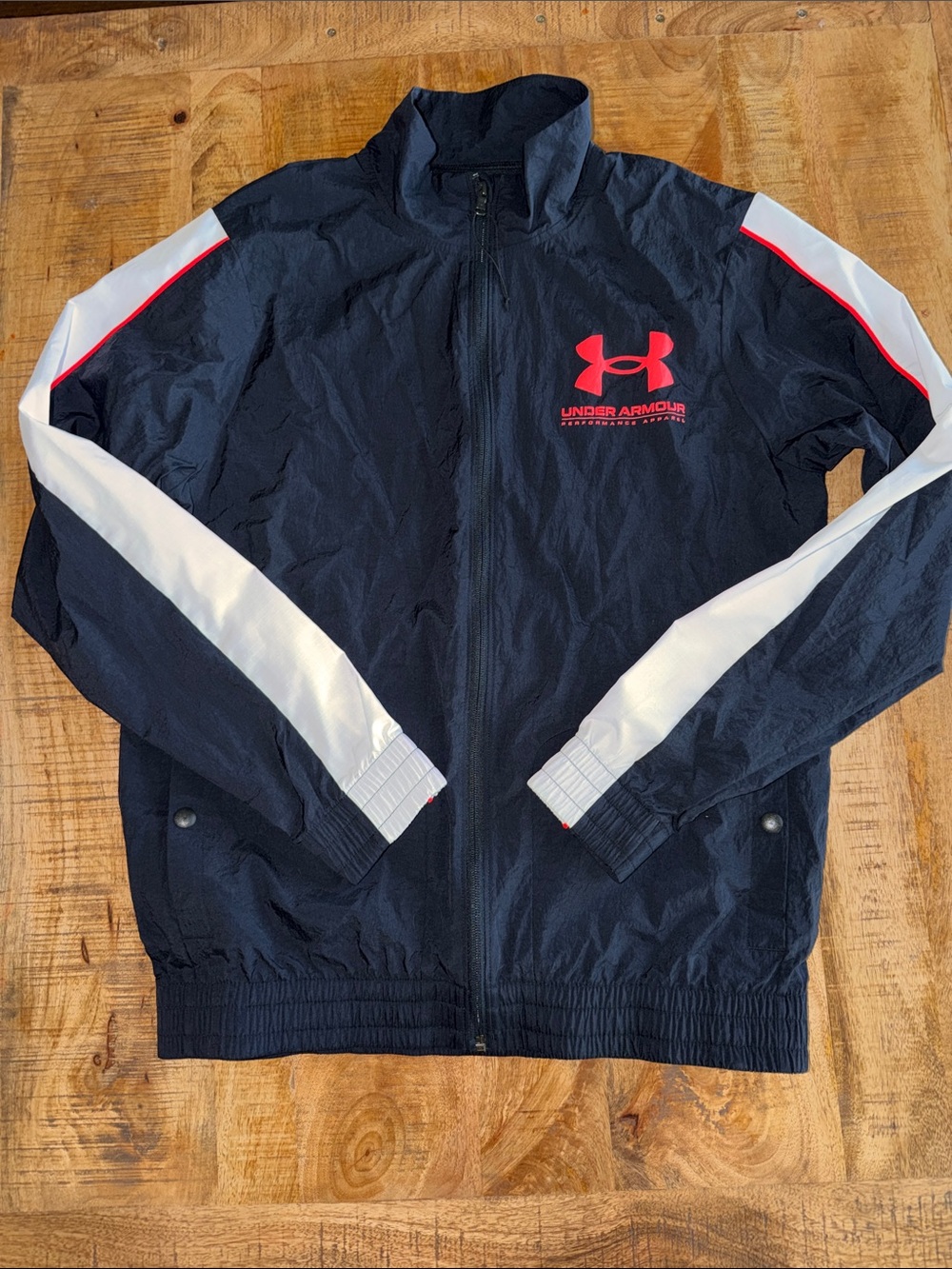 Under Armour Navy Jacket with White Sleeve Stripes and Red Logo